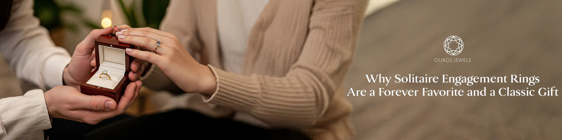 An image showing person holding a solitaire engagement ring in a red velvet luxurious box.