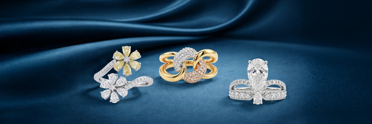 Three lab-grown diamond fashion rings — floral cluster bypass with fancy yellow diamonds, yellow gold interlocking loop with rose gold pavé, and pear cut solitaire with split pavé band