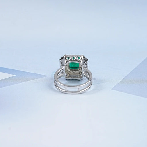 back view of green asscher cut gemstone diamond halo anniversary ring