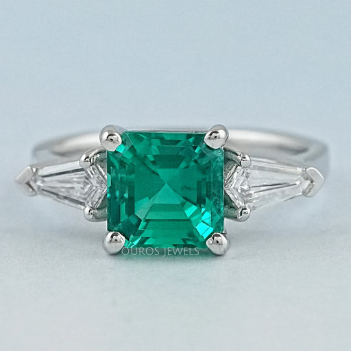 front view of asscher cut green gemstone with bullet diamond 3 stone wedding ring