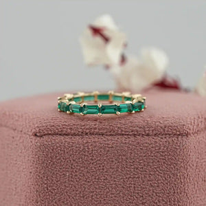 Bague d'éternité en pierre précieuse taille baguette et émeraude verte