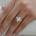 marquise and baguette cut diamond five stone engagement ring on model's finger