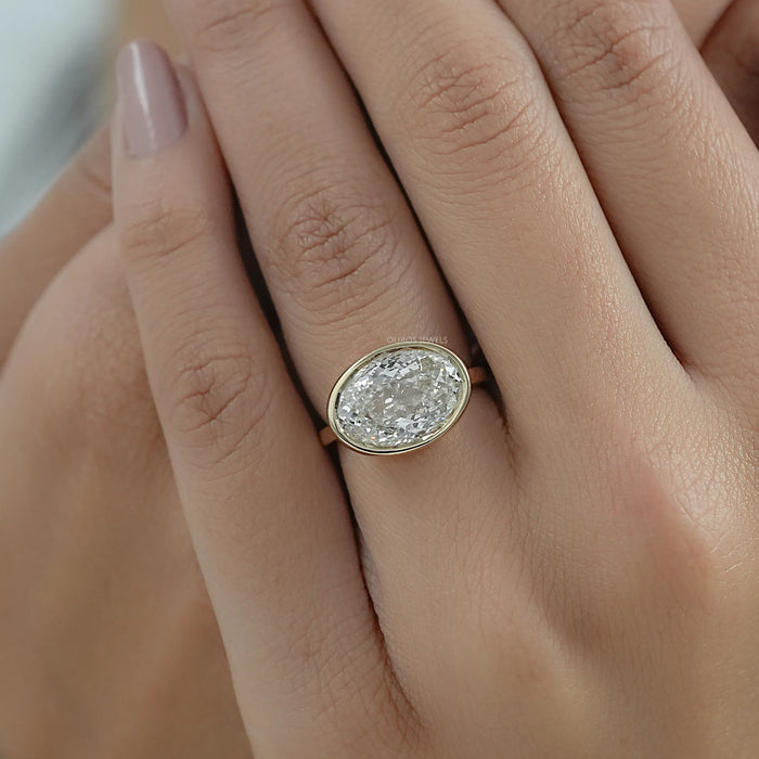 East West Portuguese Oval Bezel Set Engagement Ring