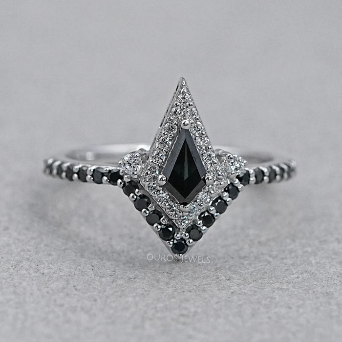 front view of black kite-cut lab diamond curved halo wedding ring on grey fabric