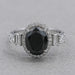 front view of black oval-cut lab diamond halo 5-stone colored engagement ring