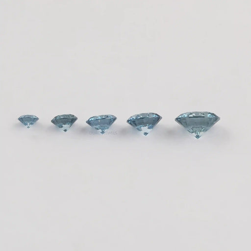 side view of blue round cut lab created colored diamonds loose