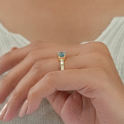 East-West Blue Step Cut Oval Accent Diamond Ring