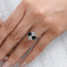 princess-cut black lab diamond solitaire anniversary ring in the finger