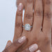 cushion cut lab diamond halo engagement ring on model's hand