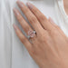 pink emerald lab diamond three-stone hidden halo colored engagement ring in finger