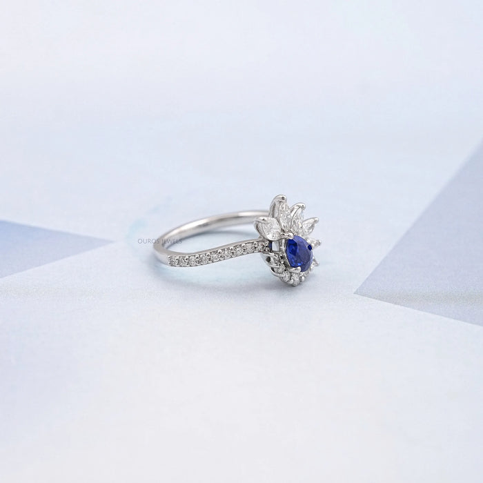 right view of pear cut blue sapphire gemstone cluster bypass engagement ring