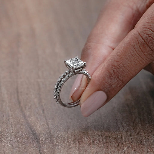 side view of princess-cut diamond solitaire bridal ring set with white gold band