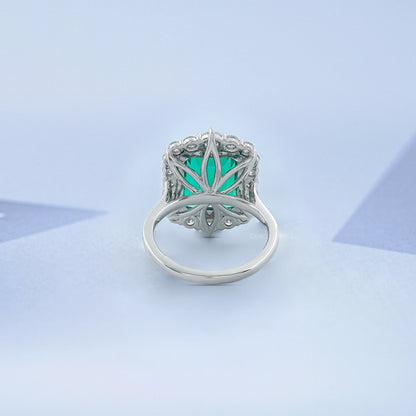 Bague de fiançailles Halo avec accent de diamant et émeraude verte