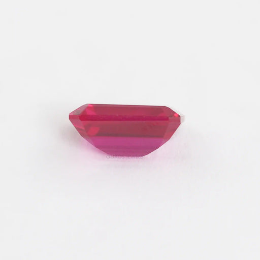 side view of emerald cut light red ruby lab created gemstones