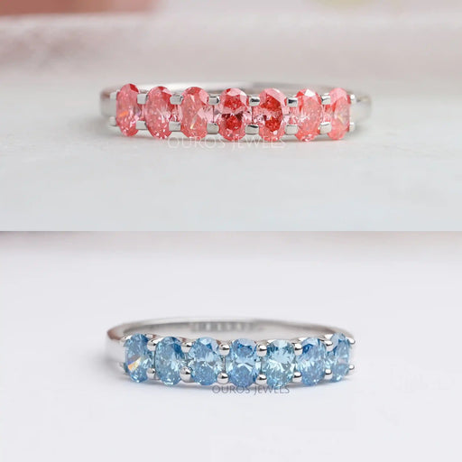 front view of pink and blue oval-cut seven stone lab diamond wedding bands