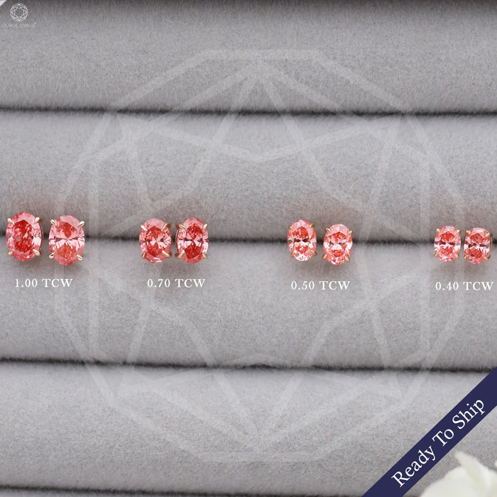 front view of pink oval cut lab grown diamond screw back earrings on box