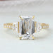 front view of criss cut diamond three stone engagement ring with yellow gold band