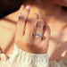 criss-cut lab-grown diamond solitaire accent engagement ring on model's finger