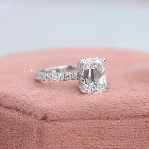 side view of criss-cut lab diamond solitaire accent engagement ring on jewelry box