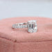 side view of criss-cut lab diamond solitaire accent engagement ring on jewelry box