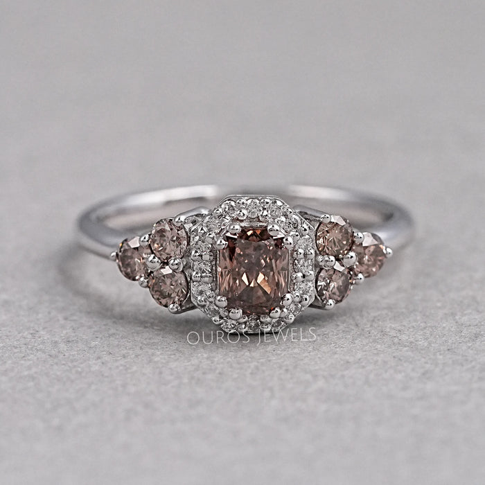 front view of brown cushion cut diamond halo wedding ring on grey fabric