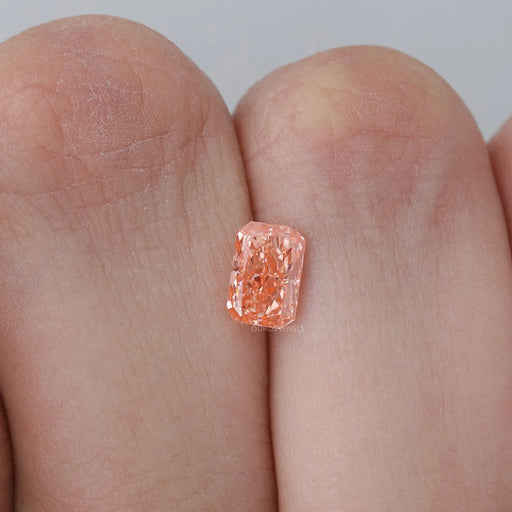 1.05 carat pink radiant shape lab created diamond loose on hand