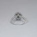 back view of green pear cut surround double halo diamond engagement ring