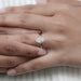 dutch marquise cut diamond hidden halo engagement ring in finger worn