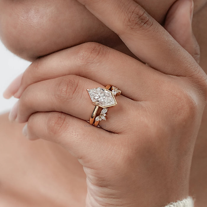 dutch marquise cut diamond wedding ring set with yellow gold band on model's finger