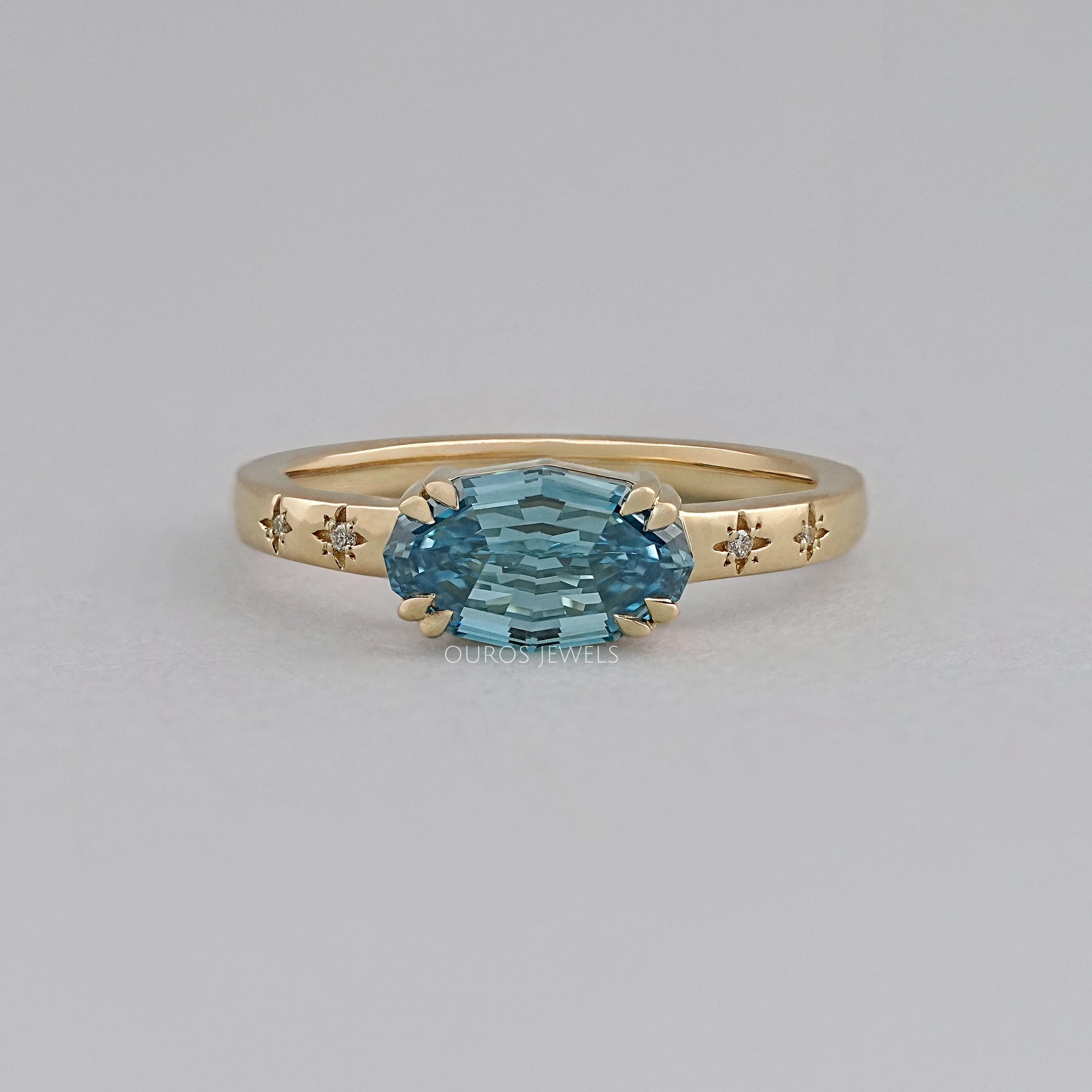 East-West Blue Step Cut Oval Accent Diamond Ring