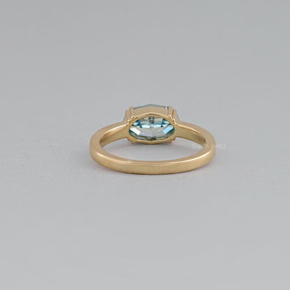 East-West Blue Step Cut Oval Accent Diamond Ring