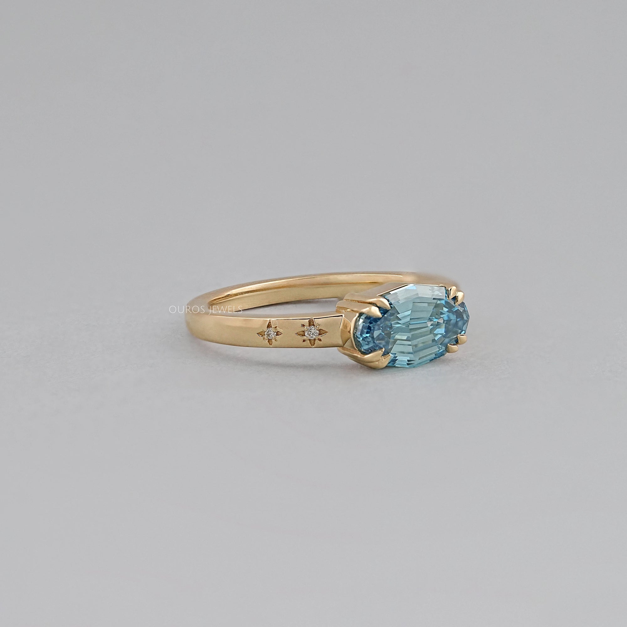 East-West Blue Step Cut Oval Accent Diamond Ring