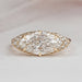 east west marquise diamond hidden halo engagement ring top view on grey background