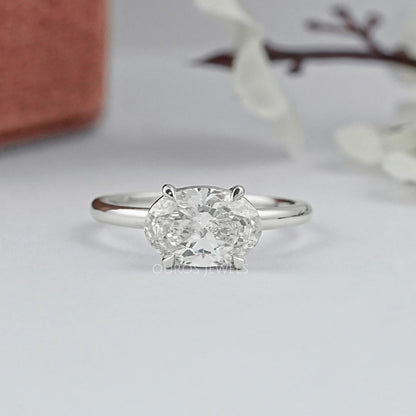 Bague solitaire de laboratoire taille poire sertie de lunette