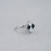 side view of princess-cut black lab diamond solitaire anniversary ring