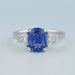 front view of sapphire cushion gemstone with trapezoid diamond 3 stone wedding ring