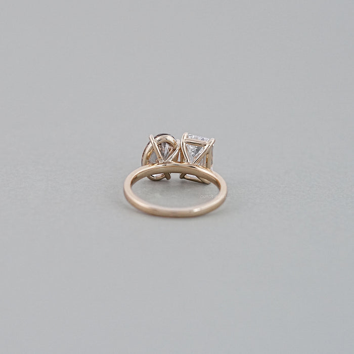 back view of emerald and champagne oval-cut diamond toi et moi engagement ring