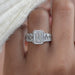front view of emerald-cut lab diamond trapezoid solitaire accent engagement ring
