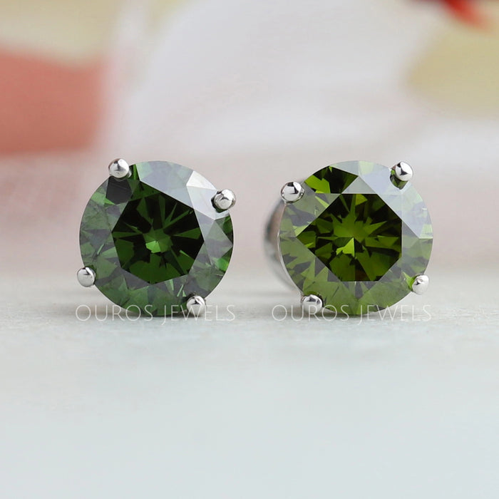 front view of green round cut lab grown diamond stud earrings white gold