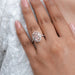 fancy pink oval cut lab diamond halo engagement ring in finger