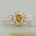 front view of fancy yellow old mine cushion diamond three stone wedding ring