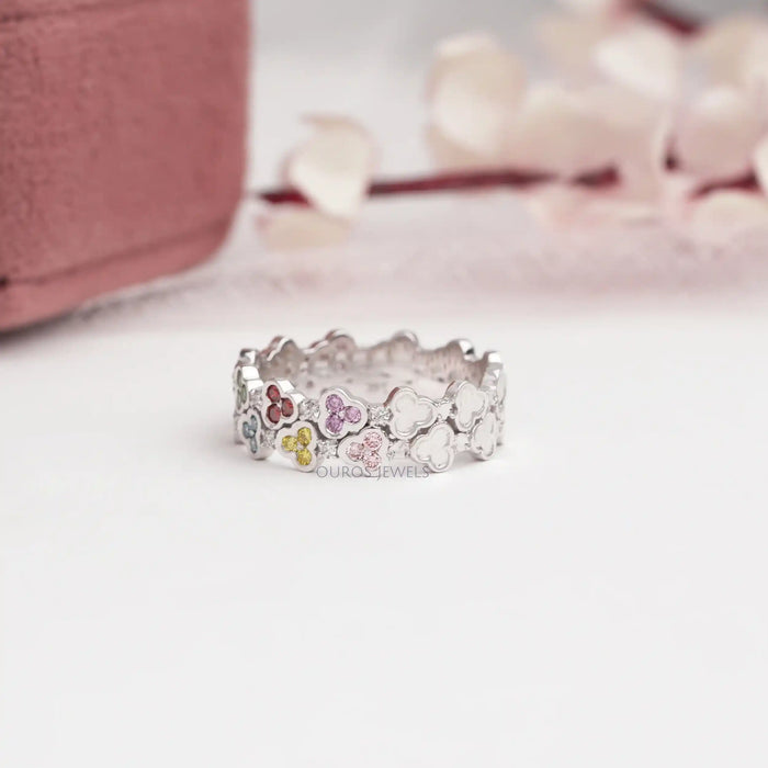 side view of rainbow color round cut lab-grown diamond colored wedding band