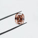 pinkish brown old mine cushion cut lab grown loose diamond held with tweezer
