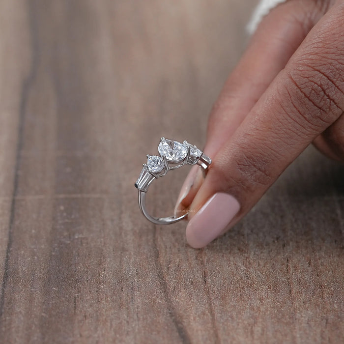 side view of pear cut lab diamond five stone engagement ring in white gold band