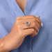 emerald-cut semi-mount five-stone engagement ring on model's finger