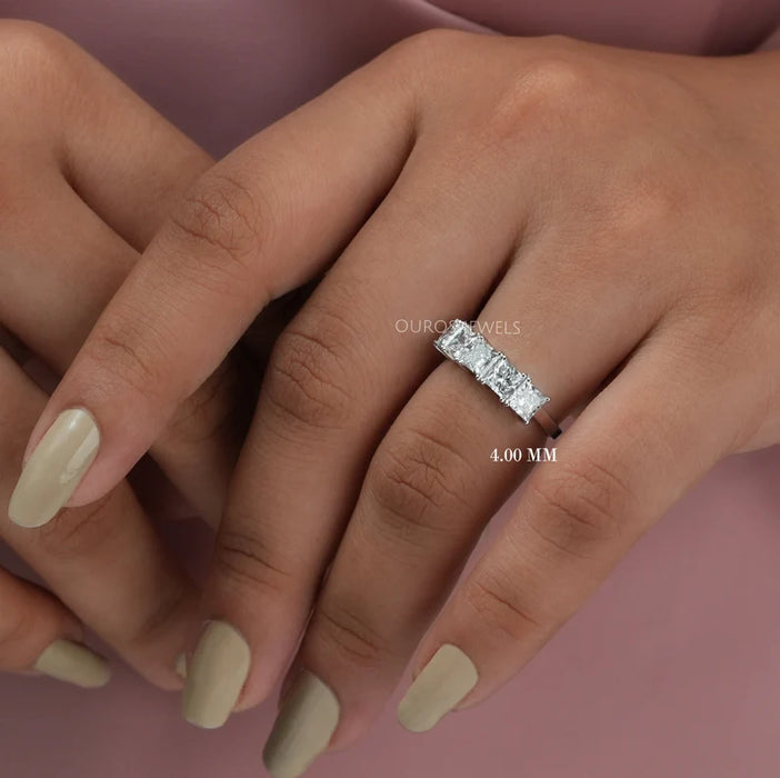 princess cut diamond five stone wedding rings with white gold band in model's finger