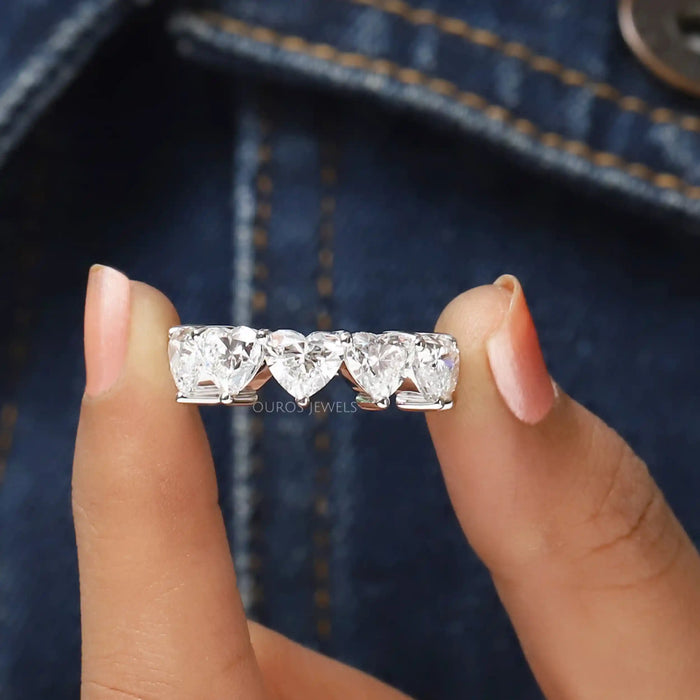 close view of heart cut lab grown diamond five stone wedding ring 