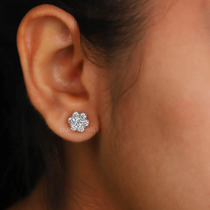 floral round cut halo diamond white gold stud earrings on ear