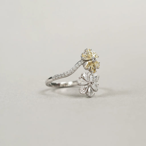side view of twin flower-shaped yellow pear cut lab diamond bypass engagement ring