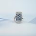 back view of sapphire and french cut lab diamond vintage engagement ring on fabric